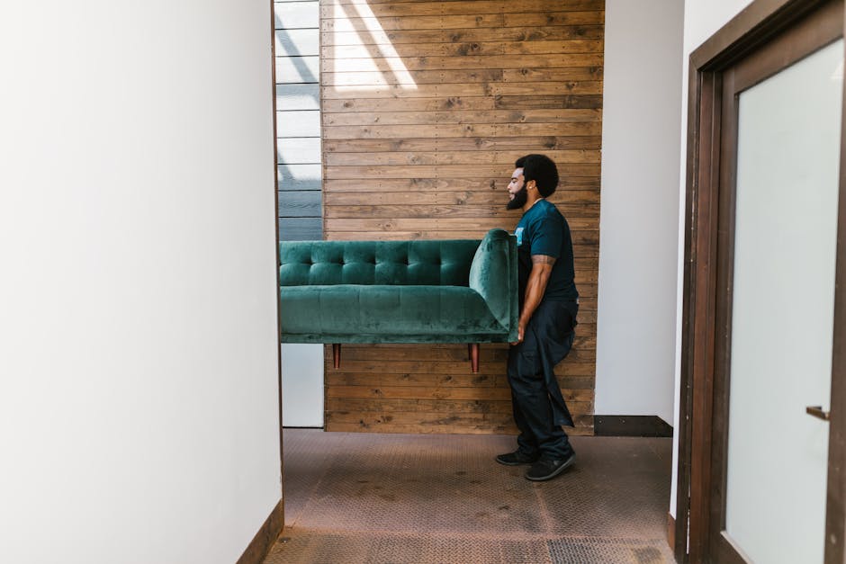 Long distance movers carrying heavy furniture
